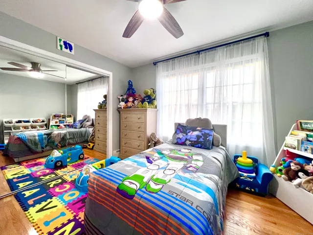 a bedroom that has a bed and a table in it