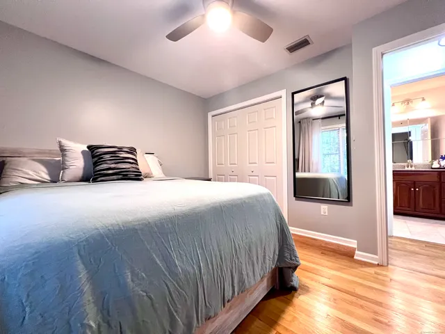 a bedroom with a bed and a view of bathroom