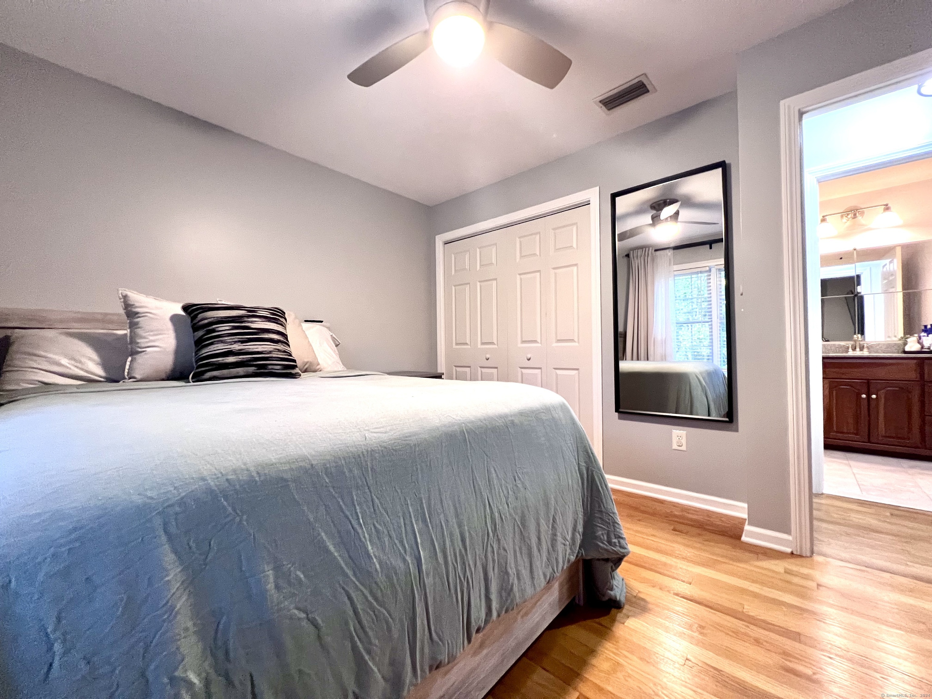 4 Cobblestone Court Naugatuck, CT 06770 - Photo 27 of 34 a bedroom with a bed and a view of bathroom
