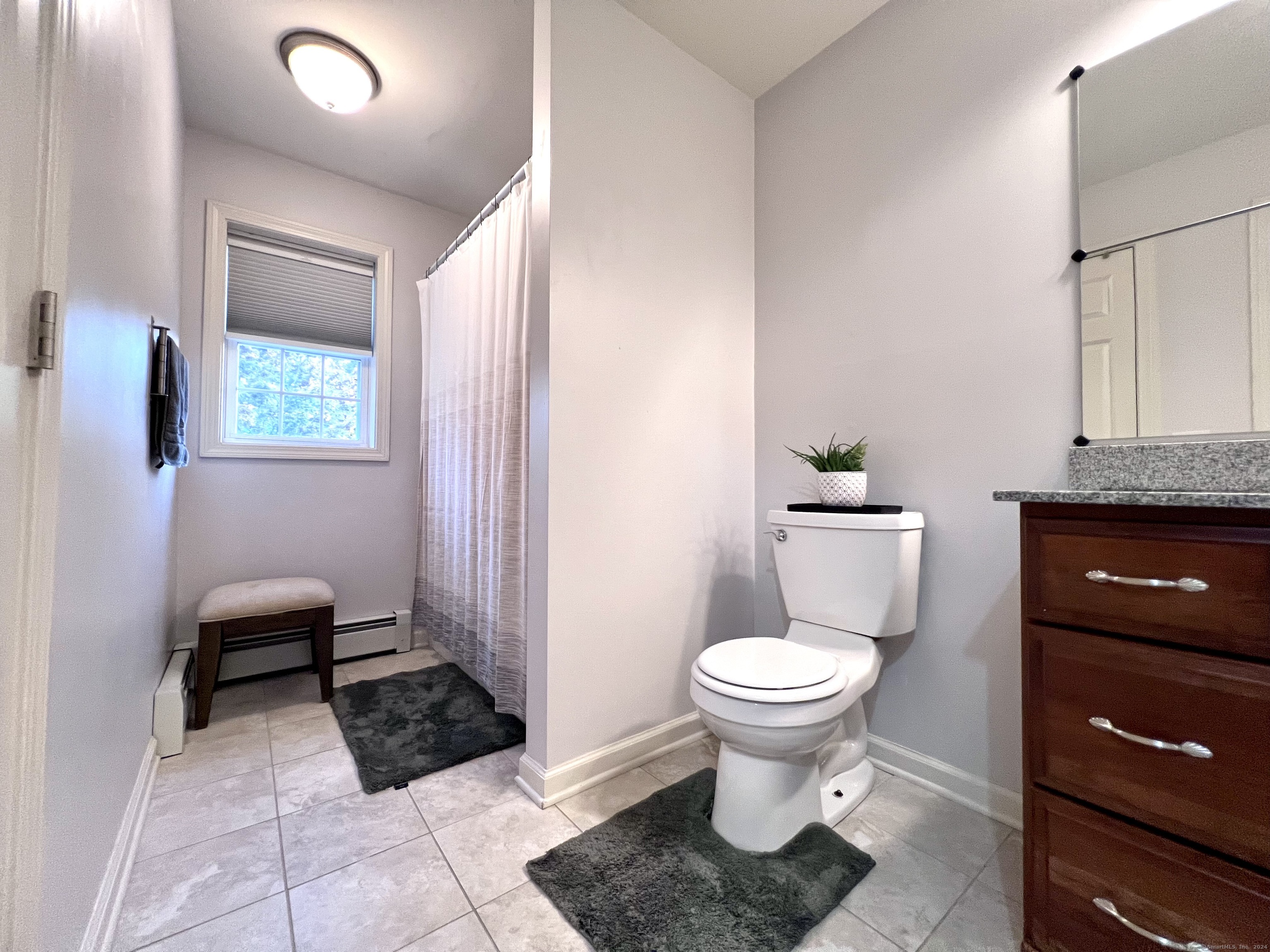 4 Cobblestone Court Naugatuck, CT 06770 - Photo 28 of 34 a bathroom with a toilet a sink and a mirror