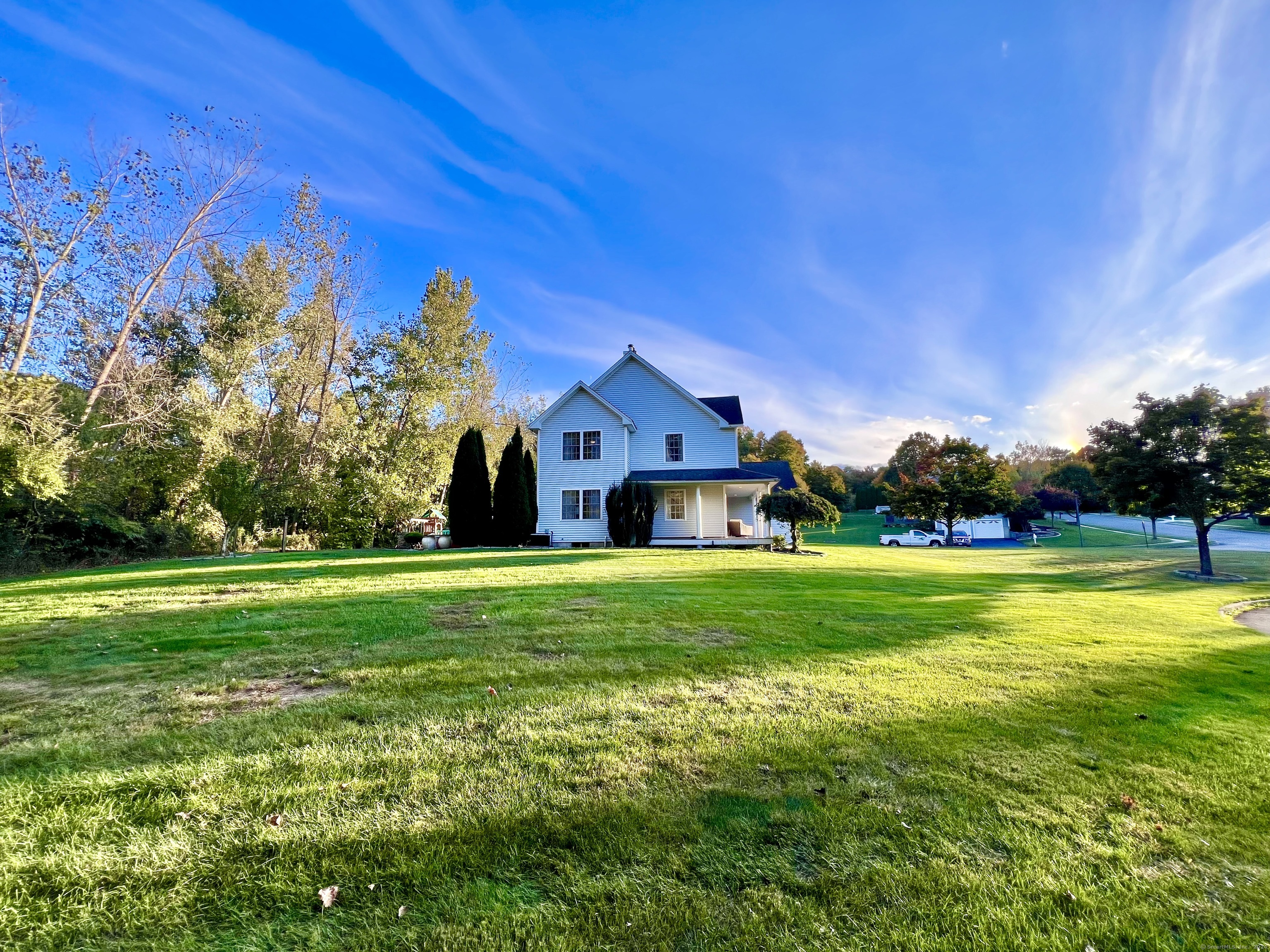 4 Cobblestone Court Naugatuck, CT 06770 - Photo 31 of 34 a front view of a house with a yard