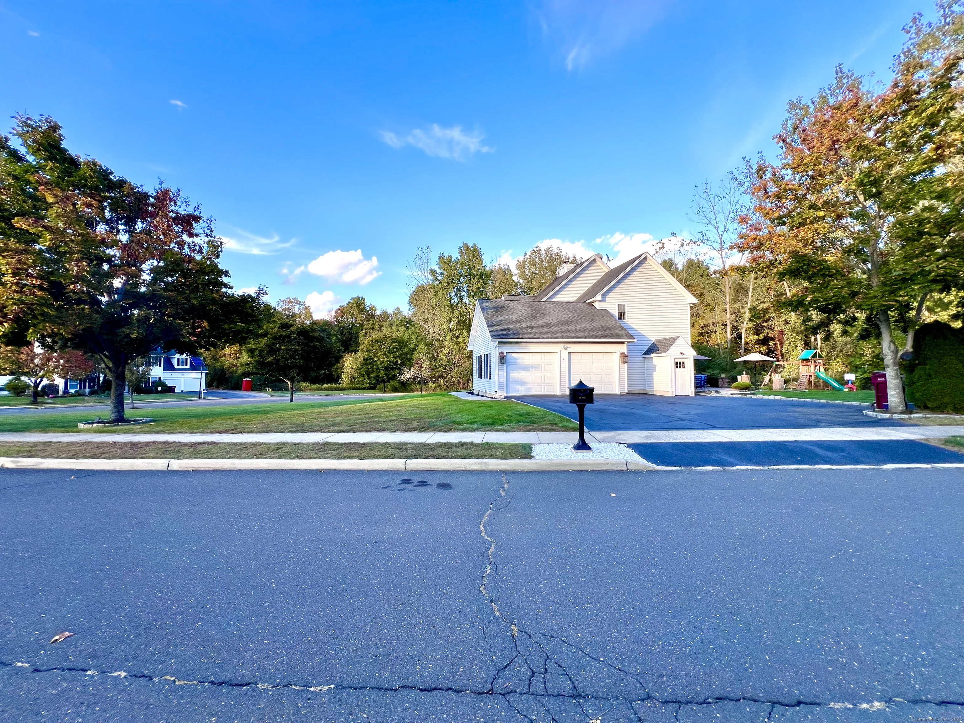 4 Cobblestone Court Naugatuck, CT 06770 - Photo 32 of 34 a view of a house with a big yard and large trees