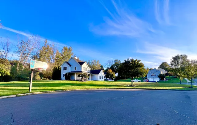 a view of pool and trees in the background