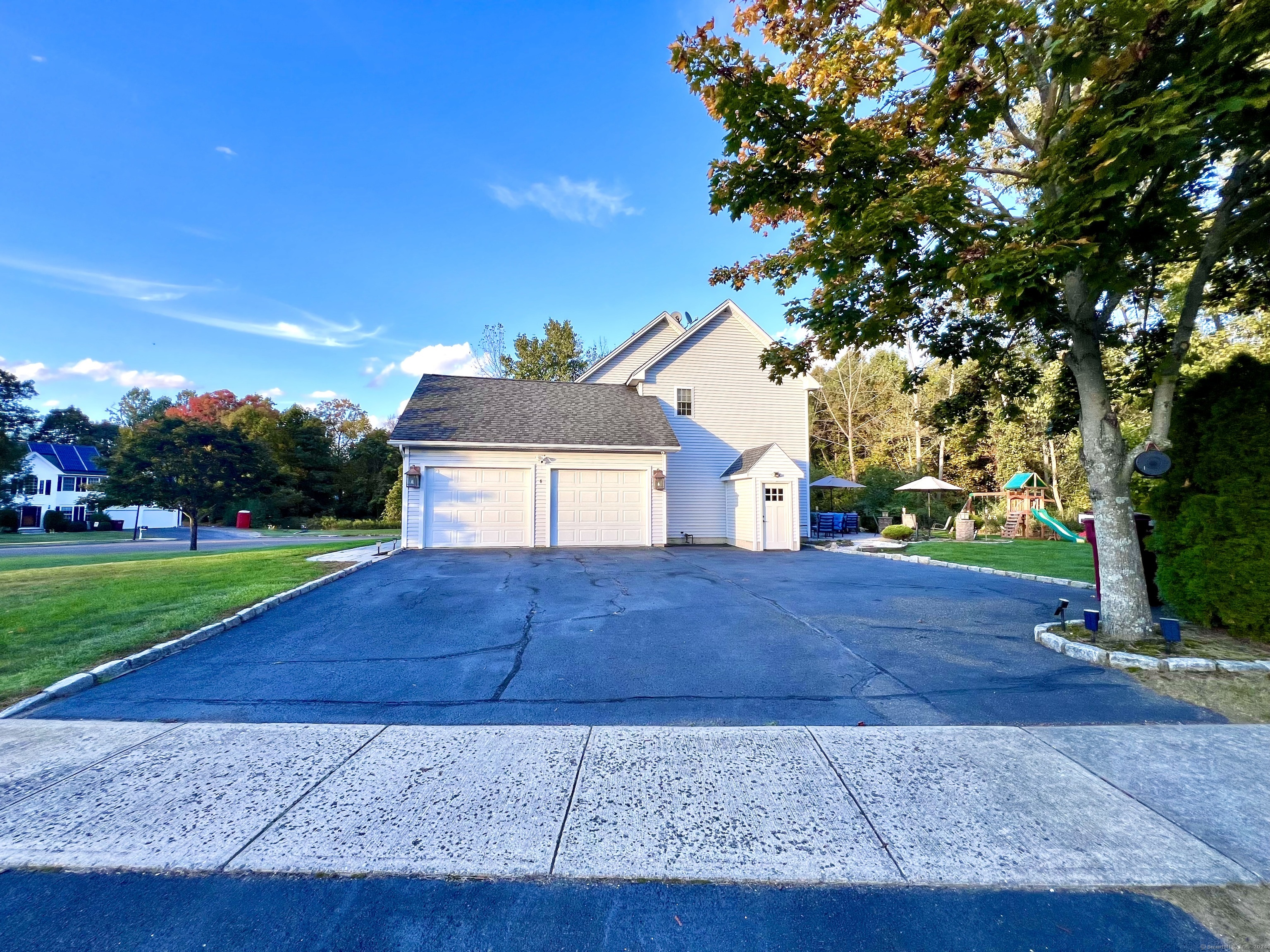 4 Cobblestone Court Naugatuck, CT 06770 - Photo 4 of 34 a house view with a garden space