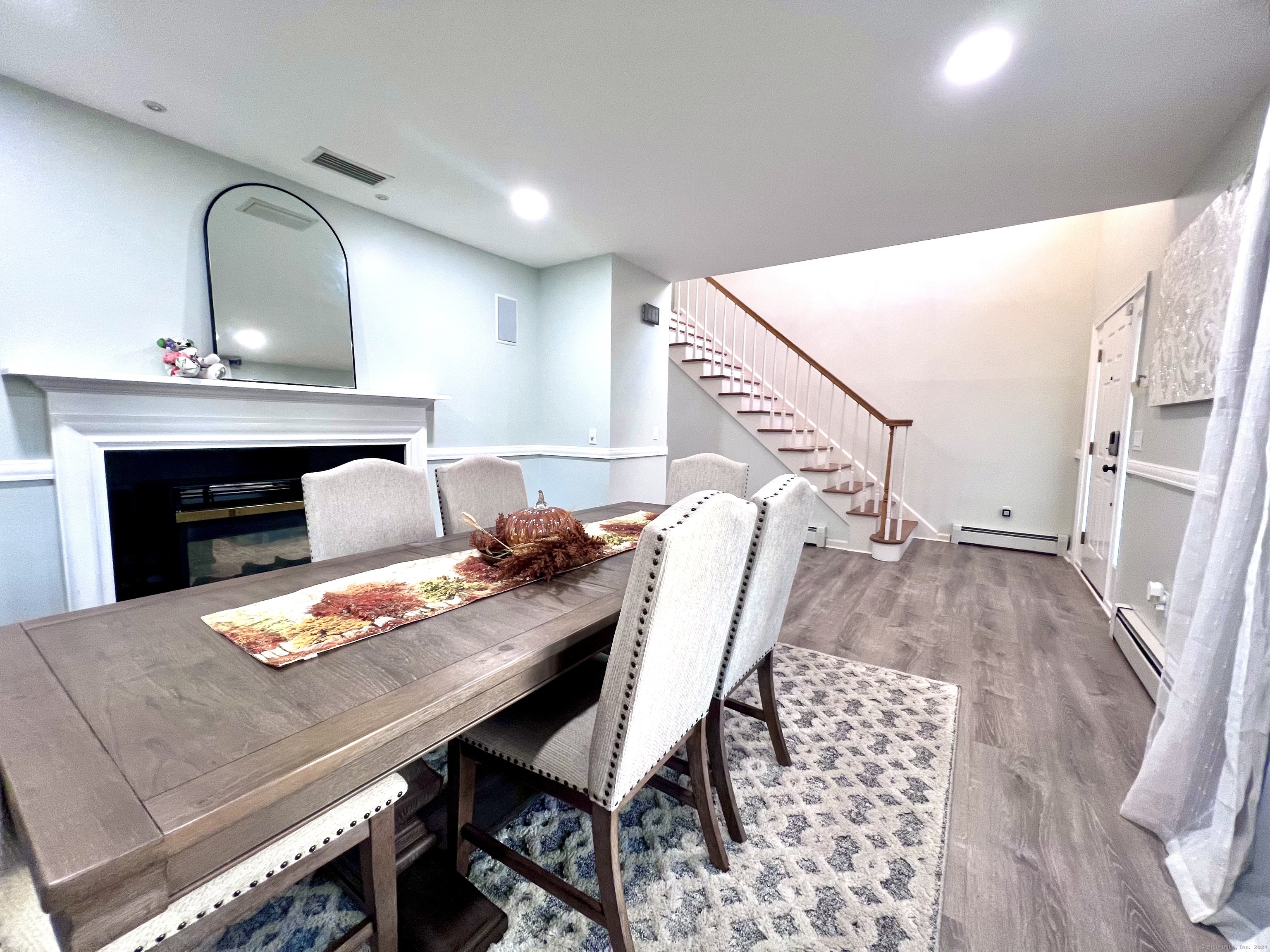 4 Cobblestone Court Naugatuck, CT 06770 - Photo 5 of 34 a view of a dining room with furniture and a fireplace