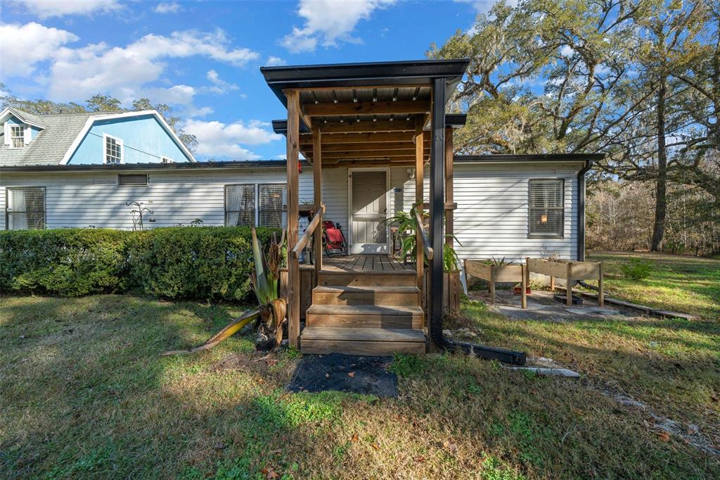 12251 Northwest 168th Place Reddick, FL 32686 - Photo 1 of 1 front view of a house with a yard