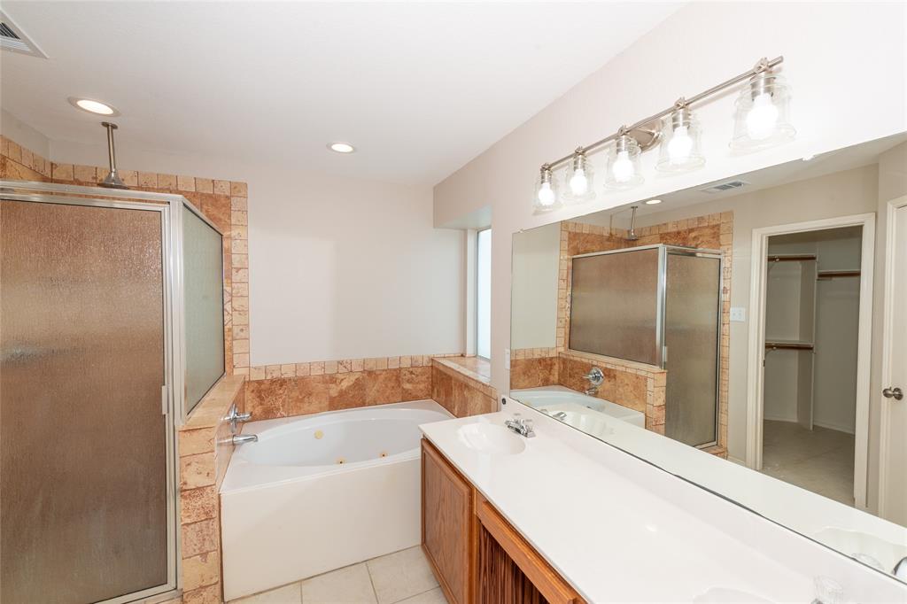 1157 Whistle Saginaw, TX 76131 - Photo 12 of 33 a bathroom with a sink a toilet and shower