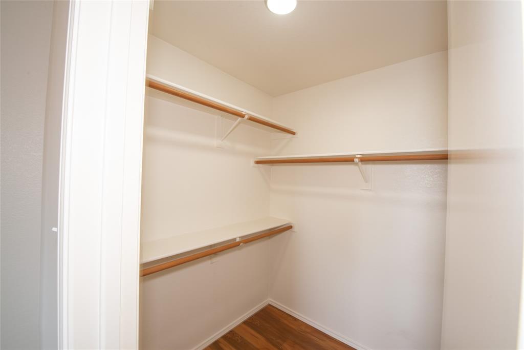 1157 Whistle Saginaw, TX 76131 - Photo 17 of 33 a view of walk in closet with empty racks