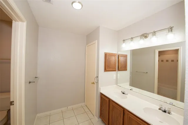 a bathroom with a toilet and a bathtub