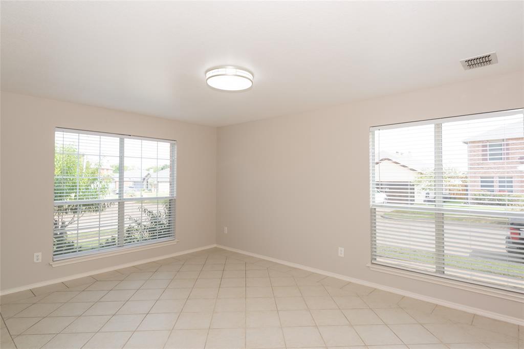 1157 Whistle Saginaw, TX 76131 - Photo 6 of 33 an empty room with a window