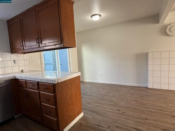 a kitchen with wooden cabinets and a sink