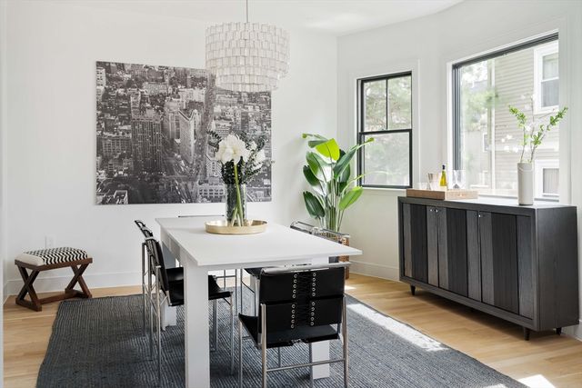a view of a dining room with furniture and window