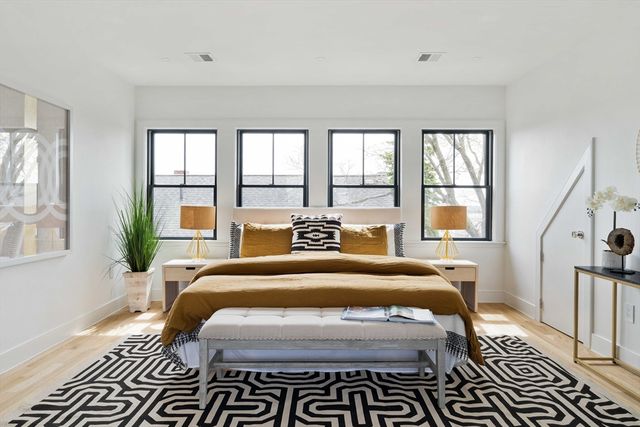 a bedroom with double bed and a window