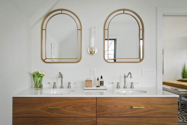 a bathroom with mirror and