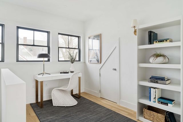 a workspace with furniture and window