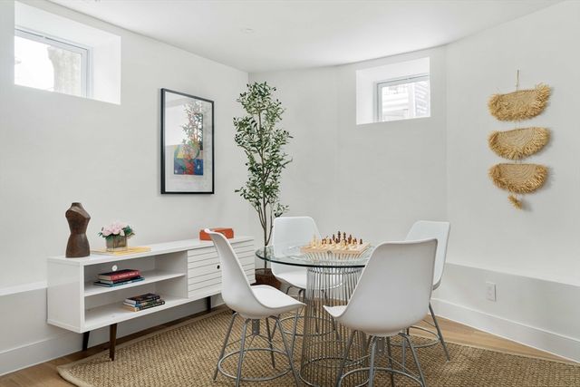 a dining room with furniture and window