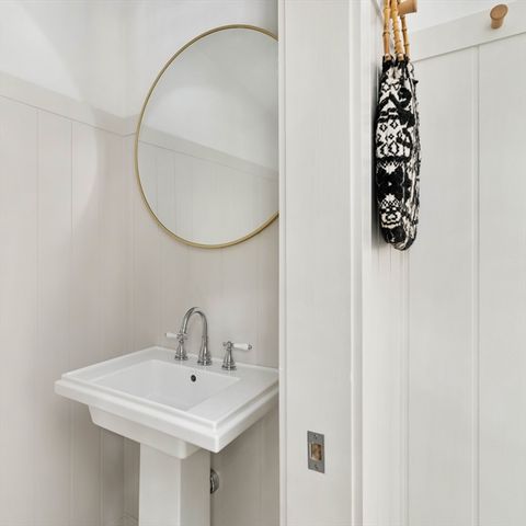 a bathroom with a sink and mirror