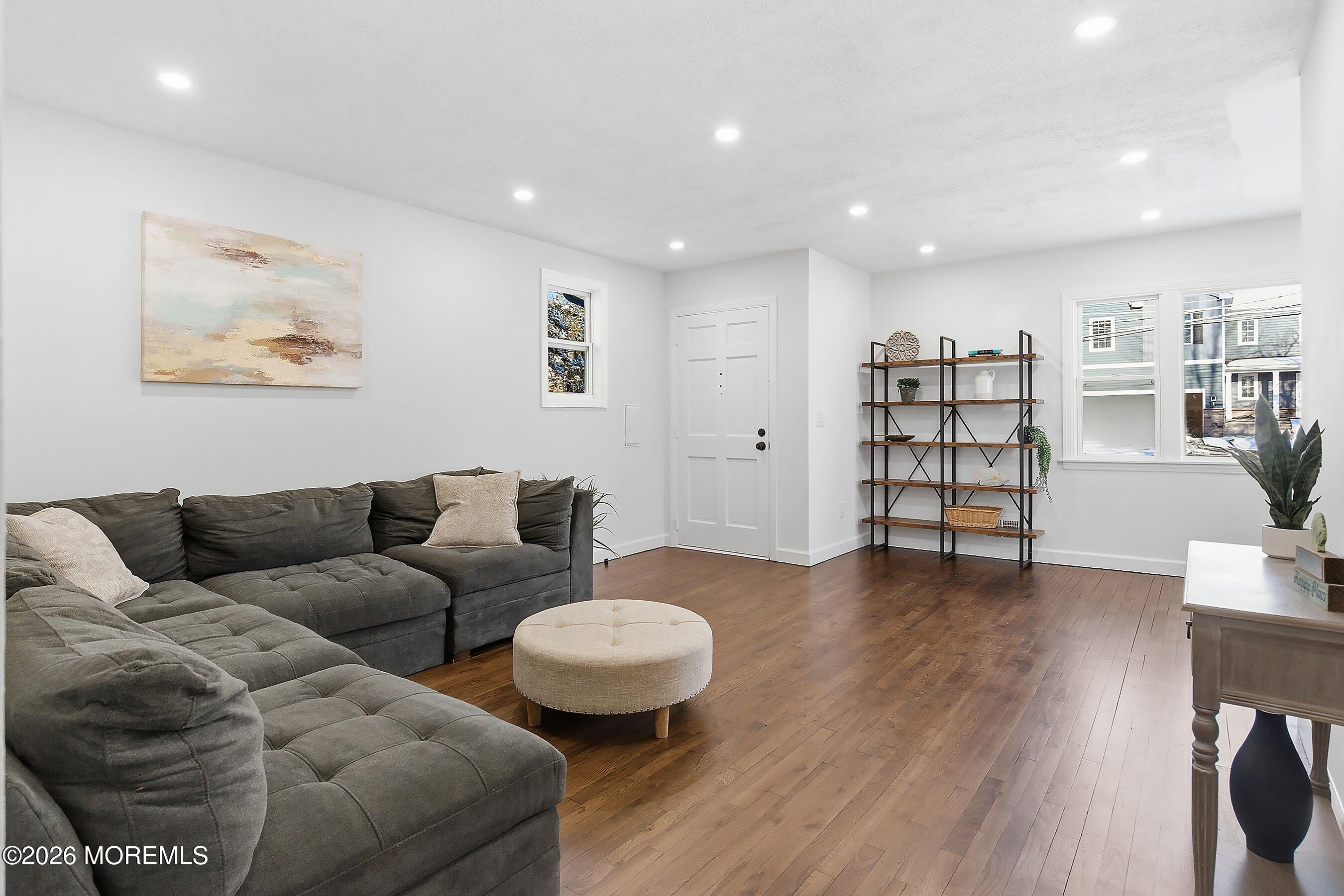 123 West 4th Street Howell, NJ 07731 - Photo 18 of 25 a living room with furniture and a wooden floor