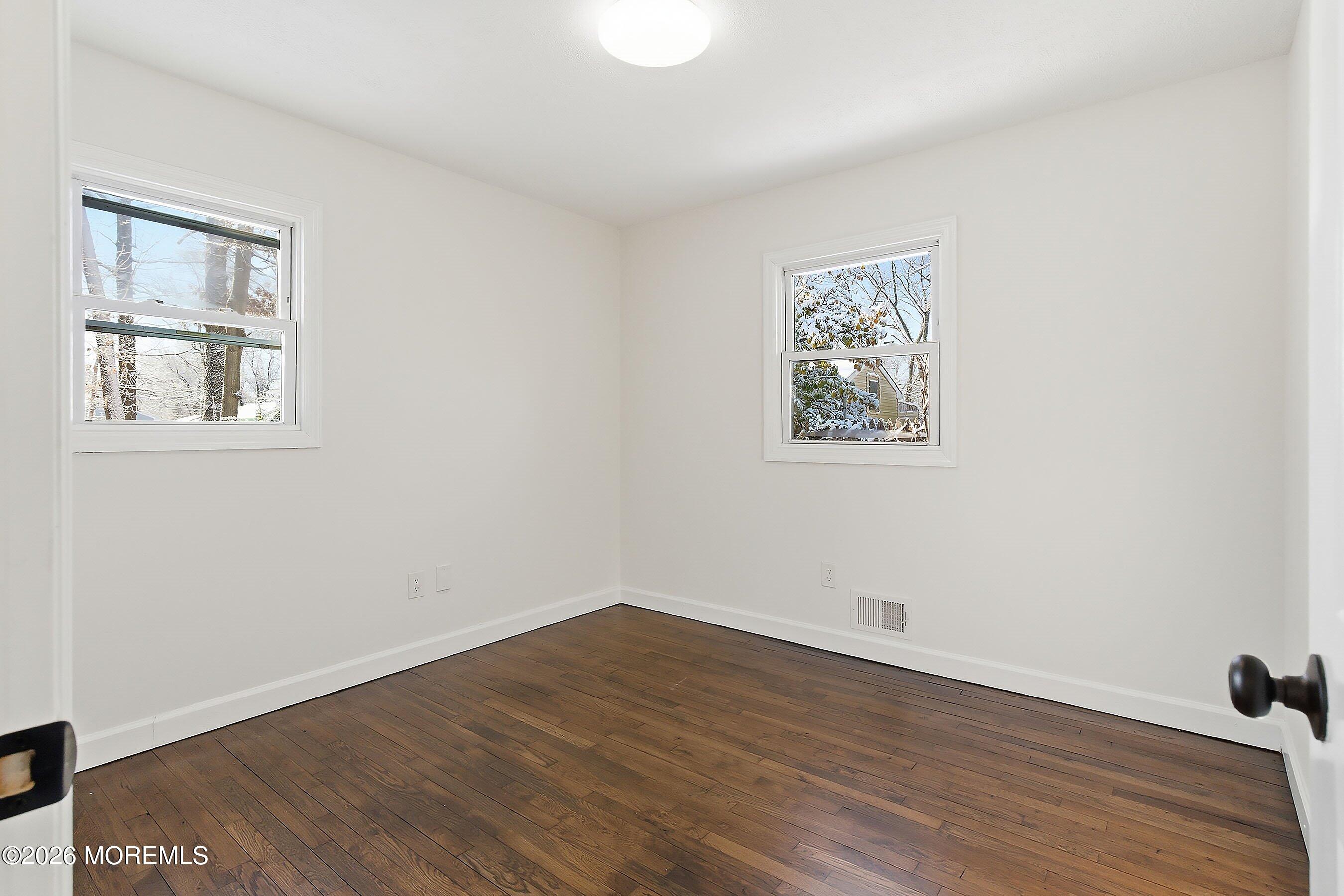 123 West 4th Street Howell, NJ 07731 - Photo 23 of 25 wooden floor in an empty room with a window