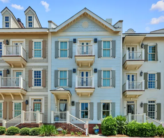a front view of a residential apartment building with a yard