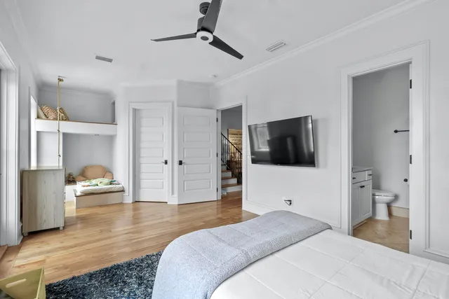 a bedroom with a bed furniture and a book shelf