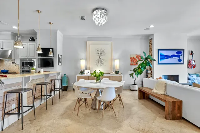 a living room with fireplace furniture and a wooden floor
