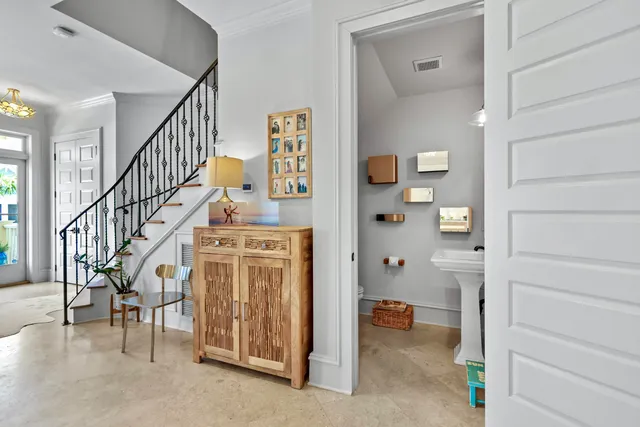 a kitchen with sink and a flat screen tv