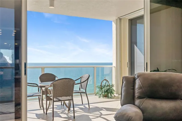a view of a dining room with furniture window and outside view