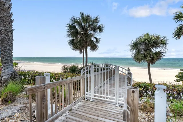 a view of a dining room with furniture and a window