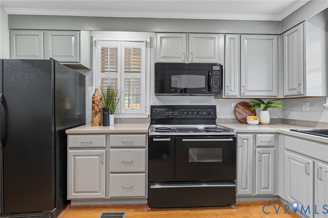 1008 Bevridge Road Richmond, VA 23226 - Photo 12 of 43 a kitchen with granite countertop white cabinets stainless steel appliances and a window