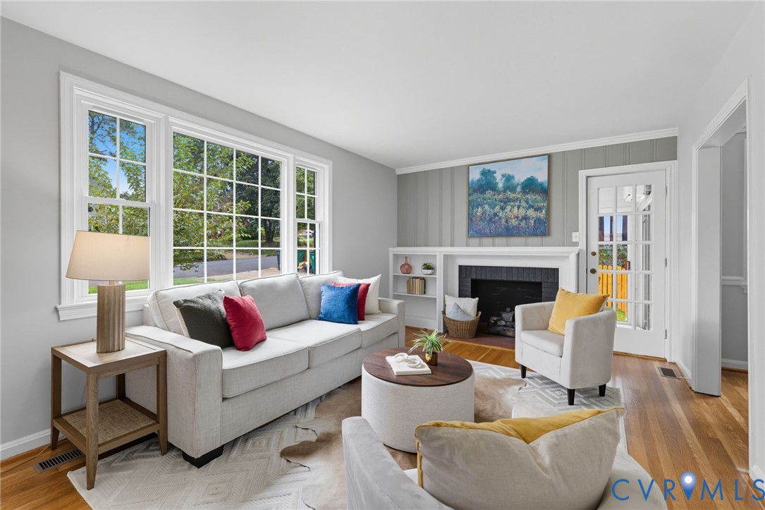 1008 Bevridge Road Richmond, VA 23226 - Photo 5 of 43 a living room with furniture a lamp and a fireplace