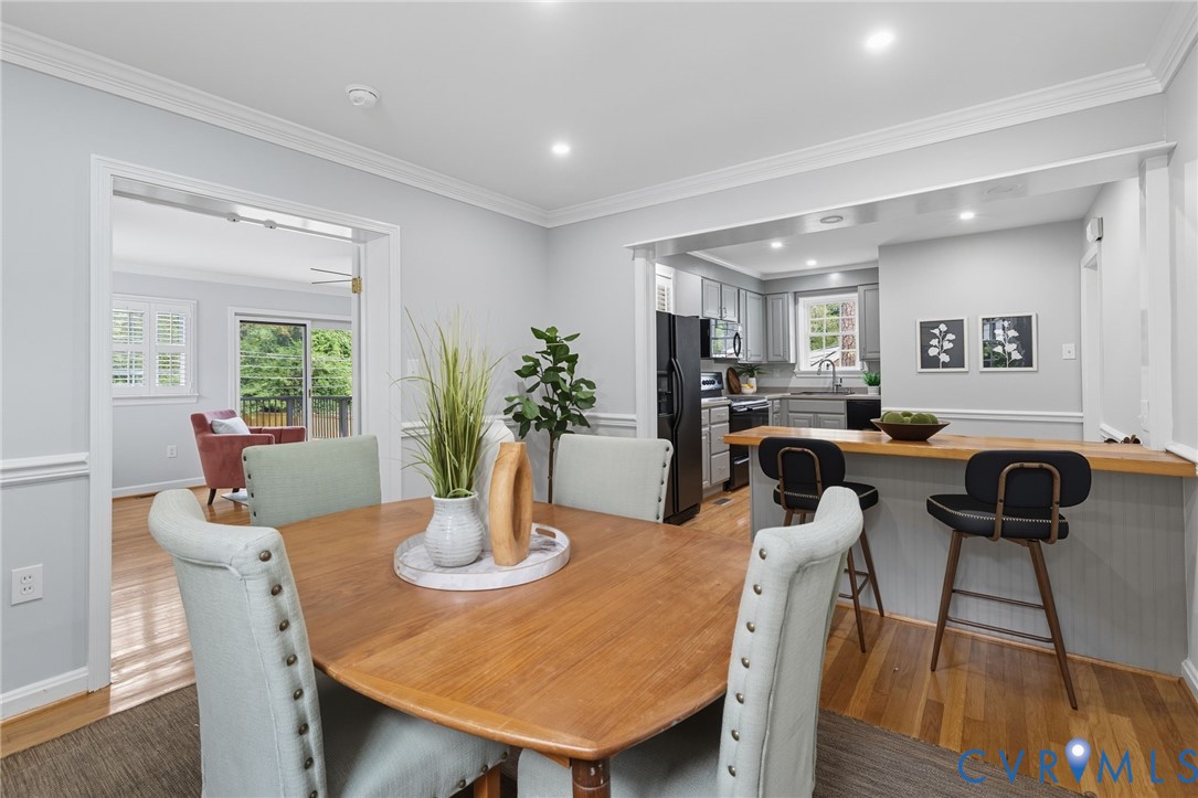 1008 Bevridge Road Richmond, VA 23226 - Photo 7 of 43 a view of a dining room with furniture and wooden floor