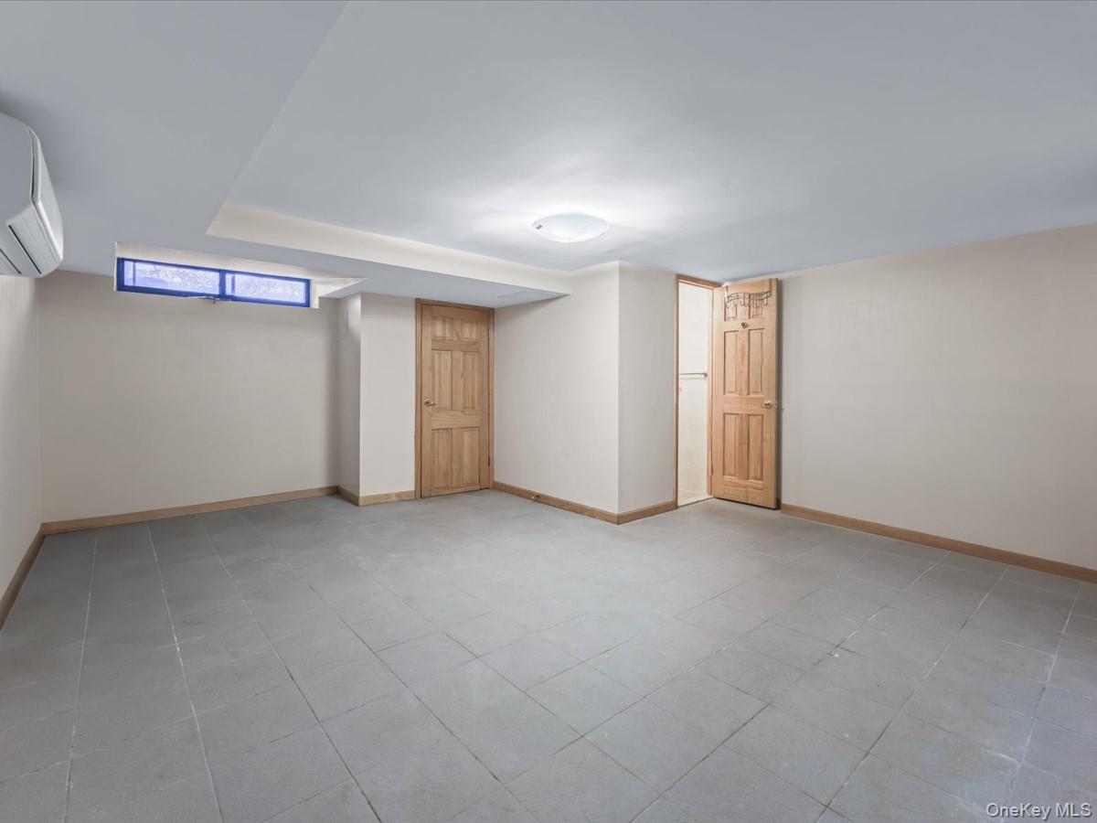 11109 75th Road Queens, NY 11375 - Photo 18 of 29 Full finished basement with egress to yard