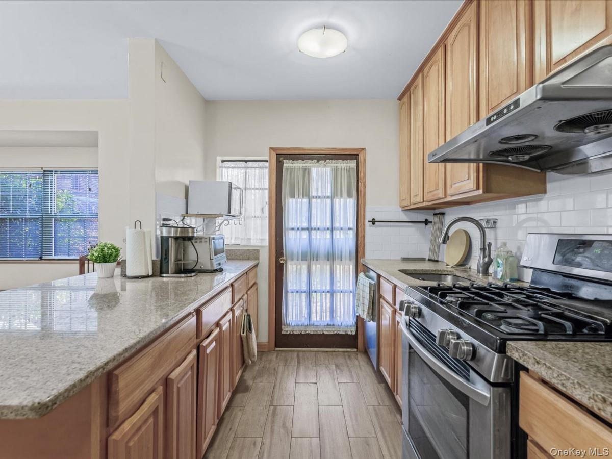 11109 75th Road Queens, NY 11375 - Photo 9 of 29 Open kitchen with exit to yard