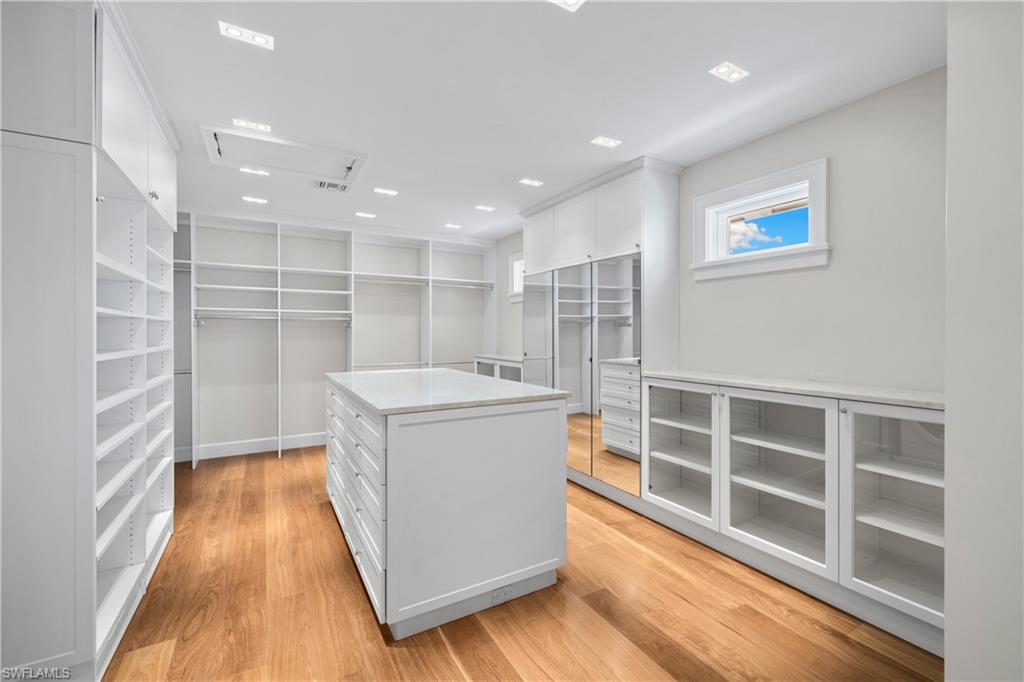 1270 Gulf Shore Boulevard South Naples, FL 34102 - Photo 17 of 24 a storage room with wooden floor and windows