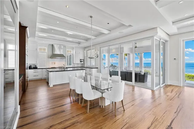 a kitchen with counter top space and wooden floor