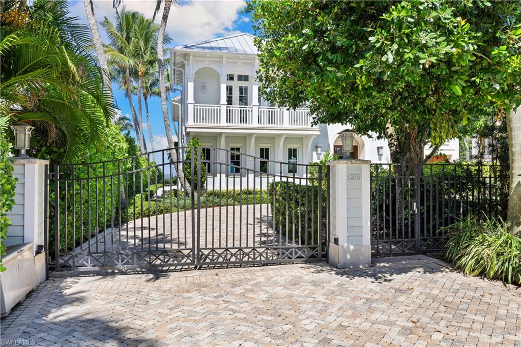 1270 Gulf Shore Boulevard South Naples, FL 34102 - Photo 5 of 24 a view of front of house with a small yard