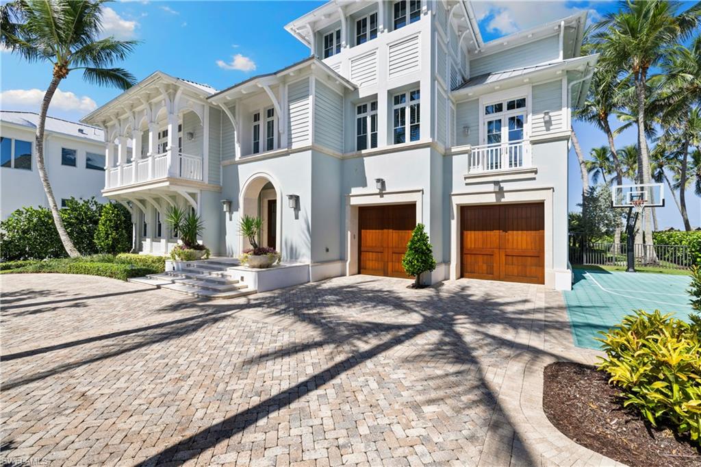 1270 Gulf Shore Boulevard South Naples, FL 34102 - Photo 6 of 24 a front view of a house with a yard