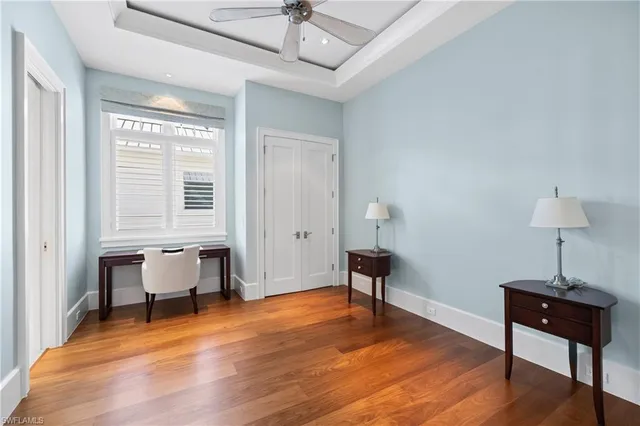 a bedroom with furniture window and wooden floor