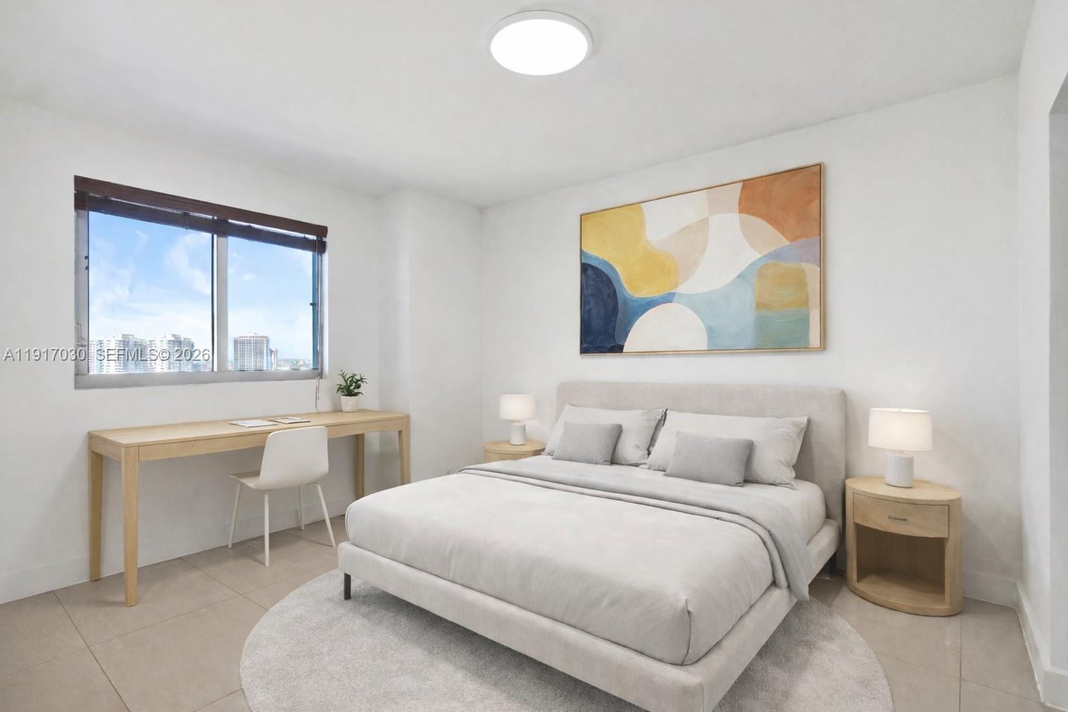 888 Biscayne Boulevard, Unit 2904 Miami, FL 33132 - Photo 17 of 27 a bedroom with a bed and window