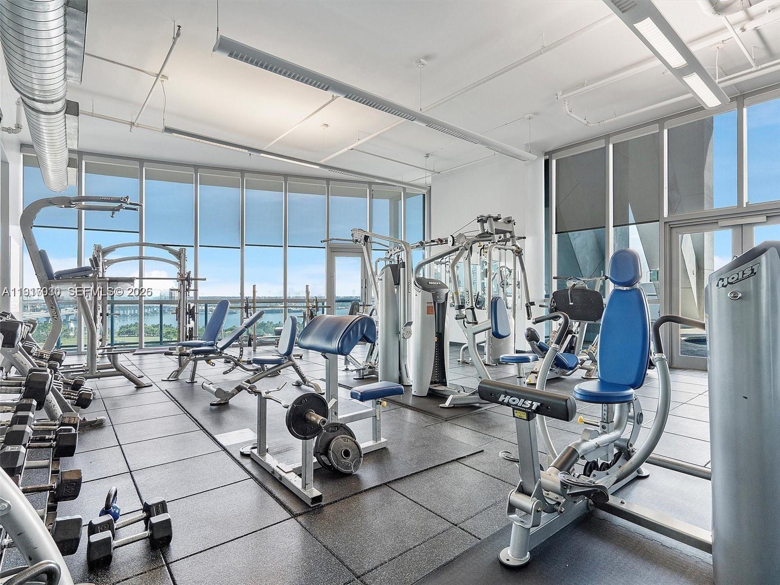 888 Biscayne Boulevard, Unit 2904 Miami, FL 33132 - Photo 22 of 27 a view of a room with gym equipment