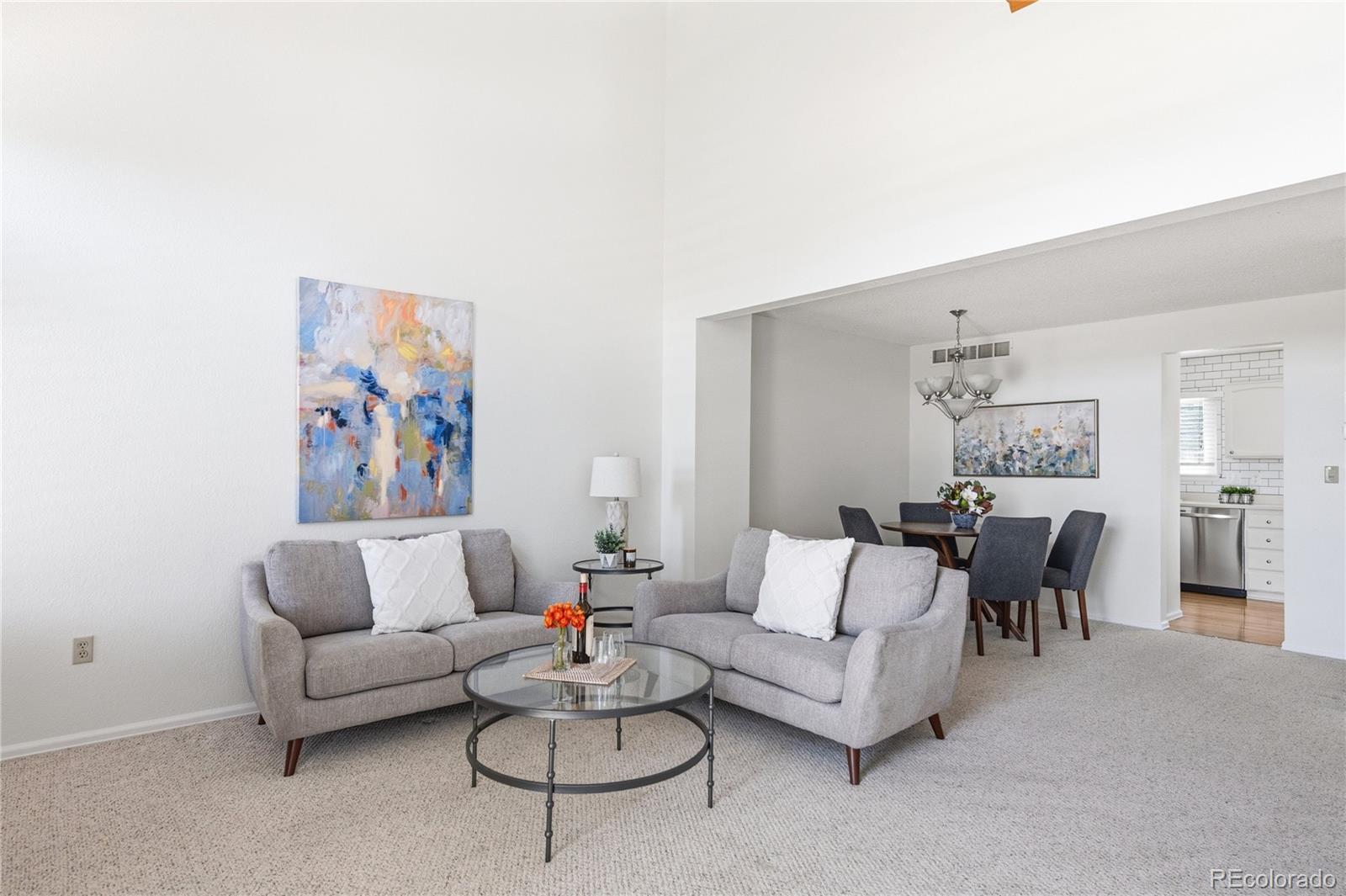 155 Blue Spruce Court Highlands Ranch, CO 80126 - Photo 6 of 29 a living room with furniture and a couch