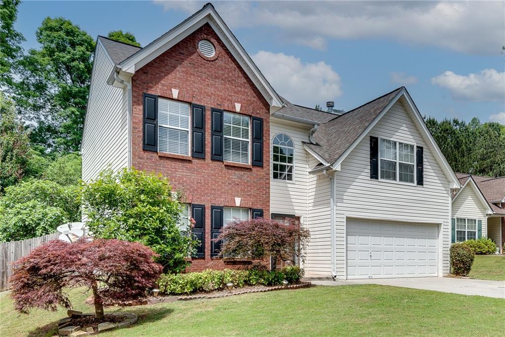 3337 Baymount Way Lawrenceville, GA 30043 - Photo 2 of 47 a front view of a house with a garden