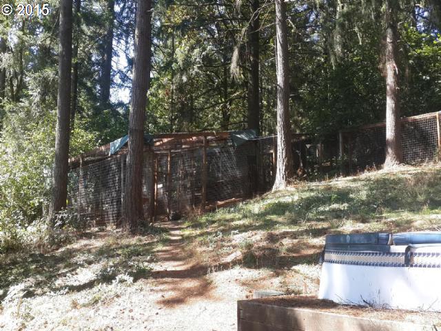 31369 Southwest Heater Road Sherwood, OR 97140 - Photo 1 of 9 a view of a yard with large tree and wooden fence