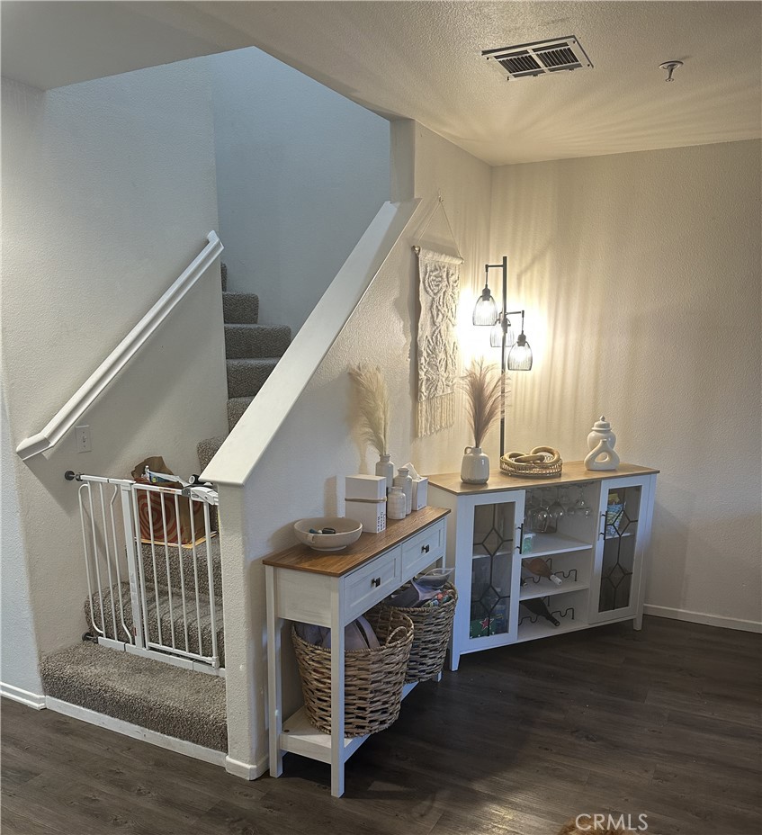 220 West Walnut Avenue, Unit B Rialto, CA 92376 - Photo 5 of 14 a view of entryway and hall with wooden floor