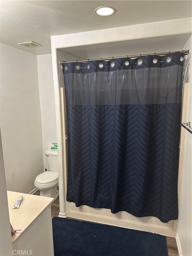 220 West Walnut Avenue, Unit B Rialto, CA 92376 - Photo 9 of 14 a bathroom with a sink and a toilet