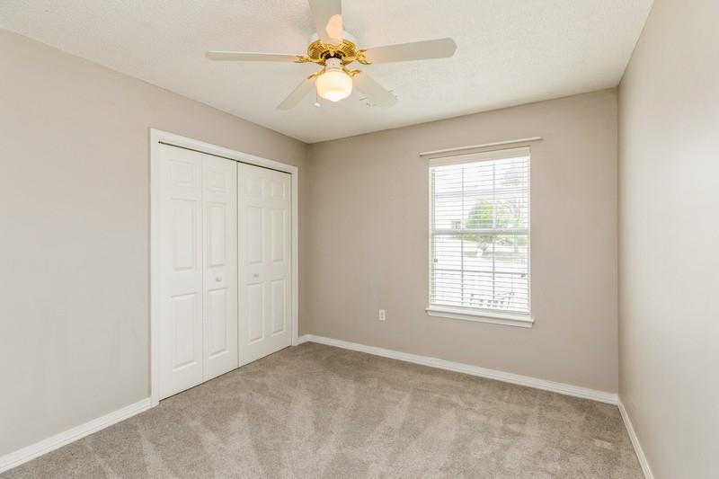 439 Northview Lane Crestview, FL 32536 - Photo 13 of 26 an empty room with windows and ceiling fan