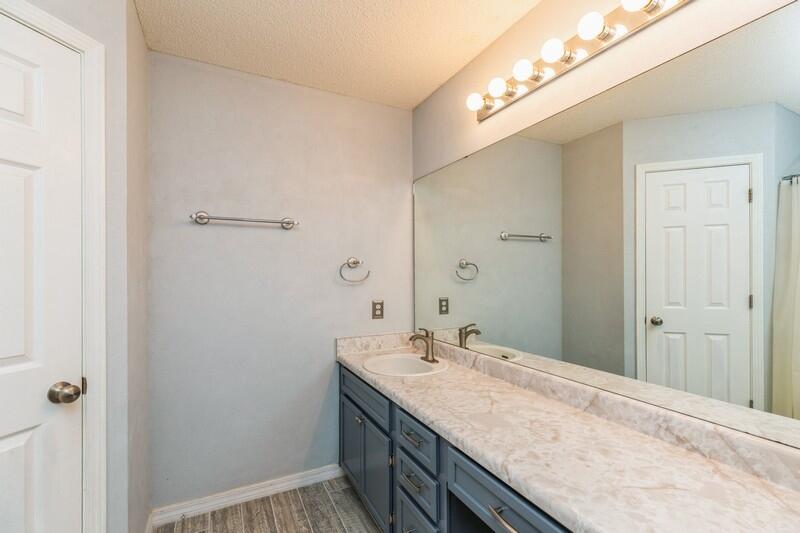 439 Northview Lane Crestview, FL 32536 - Photo 18 of 26 a bathroom with a granite countertop sink and a mirror