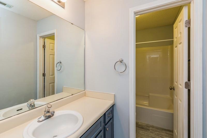 439 Northview Lane Crestview, FL 32536 - Photo 22 of 26 a bathroom with a sink and a mirror