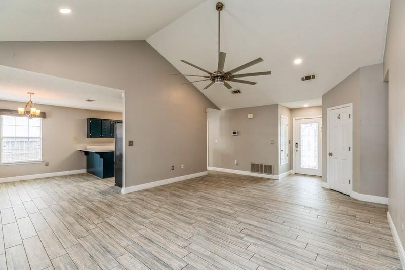 439 Northview Lane Crestview, FL 32536 - Photo 6 of 26 a view of an empty room with window and wooden floor